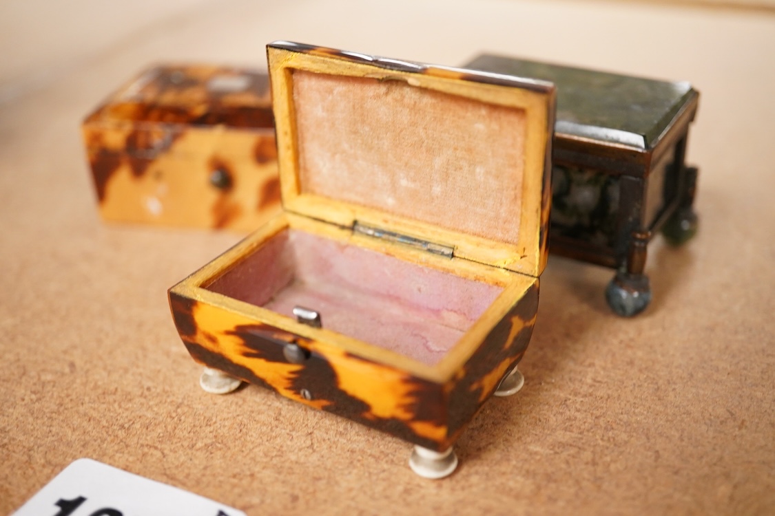 A 19th century miniature brass and agate trinket box and two early 19th century tortoiseshell needle boxes, largest 5.5cm wide x 2.5cm high
